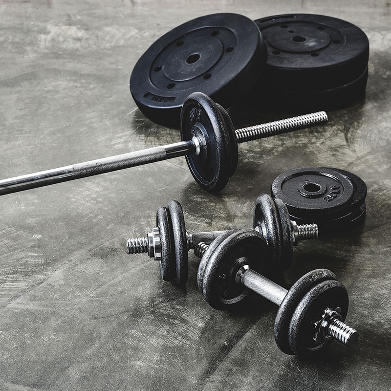 high angle view of various gym equipment on concrete floor